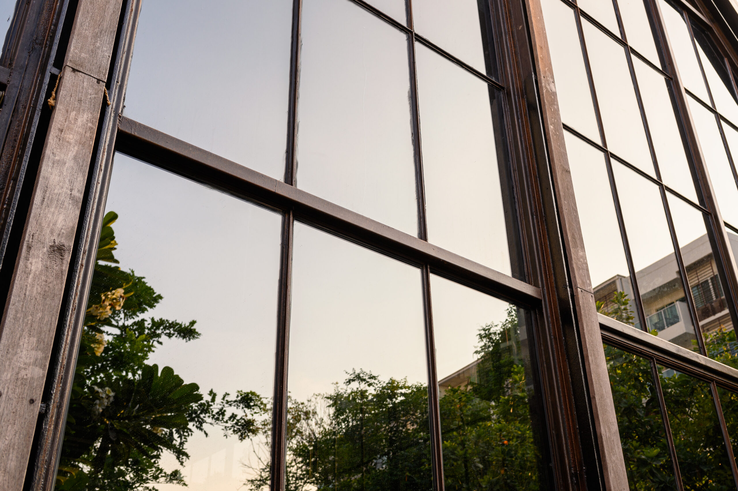 Modern industrial building with glass windows reflection